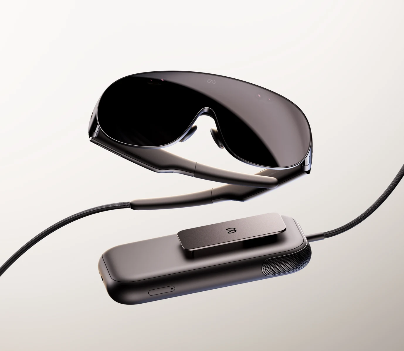 Meta VR Glasses and their connected computing puck shown in an official product close-up.
